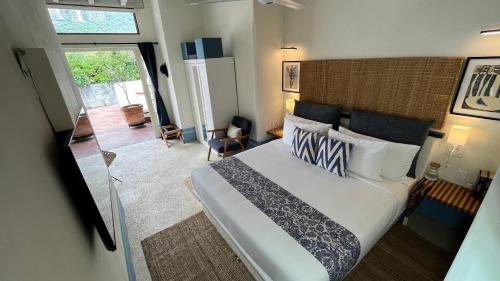 Ένα ή περισσότερα κρεβάτια σε δωμάτιο στο Hotel El Ciruelo, Tepoztlán