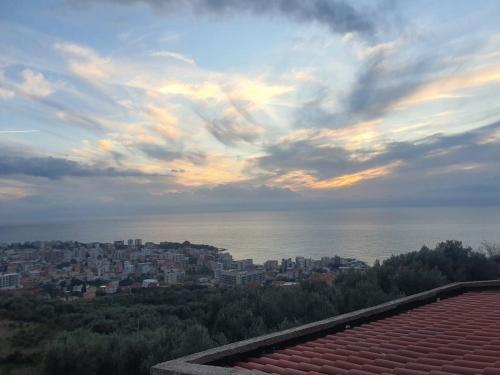 a view of a city with the ocean and buildings at Guest House Perazić in Bar