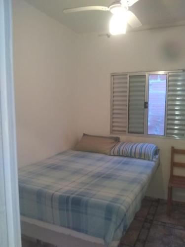 Un pat sau paturi într-o cameră la Paz da ilha