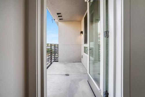 an open door to a balcony with a view at Hollywood Walk of Fame! 1BD Pool/Parking/Balcony in Los Angeles