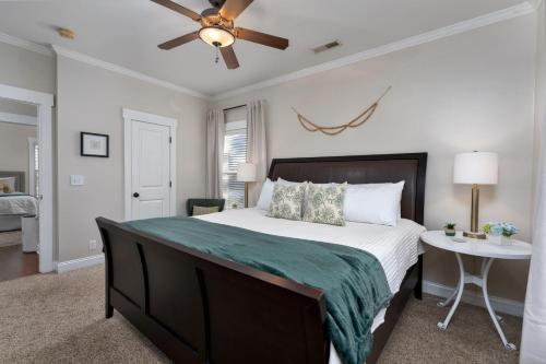 a bedroom with a large bed and a ceiling fan at Downtown Wilmington Home ~ Pet Friendly in Wilmington