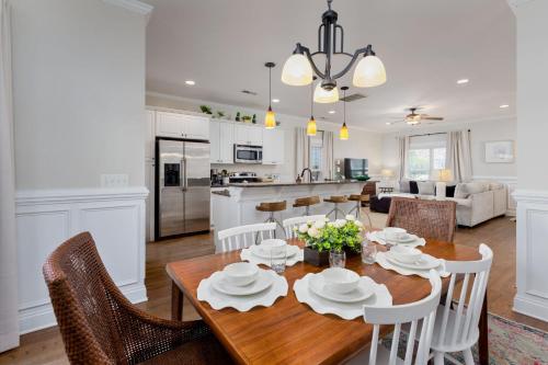 a kitchen and living room with a wooden table and chairs at Downtown Wilmington Home ~ Pet Friendly in Wilmington