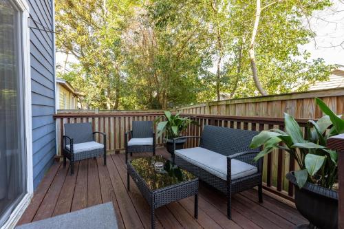 a deck with three chairs and a table and chairs on it at Downtown Wilmington Home ~ Pet Friendly in Wilmington
