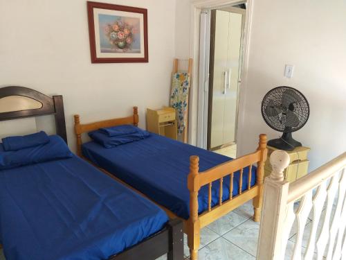 Postel nebo postele na pokoji v ubytování casa vó doca, preço único pela casa inteira,cabem até 10 pessoas ao lado da basilica aparecida