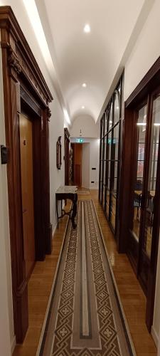 a hallway with a rug on the floor at Deluxe Spaccanapoli in Naples