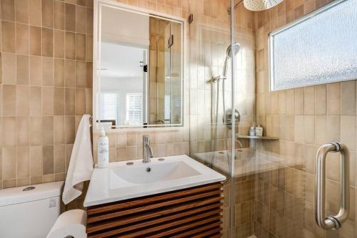 a bathroom with a sink and a shower at Private Gated 3 BD - 3 BR Modern Home in Los Angeles