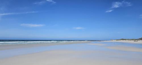 a beach with the ocean in the background at Pearly Beach House in Pearly Beach