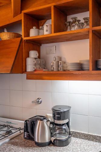 a kitchen with a coffee maker on a counter at Paihuen - Resort De Montaña in San Martín de los Andes