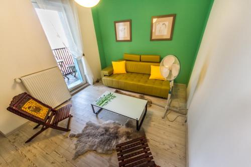 a living room with a couch and a table at OH Apartments & Rooms in Ljubljana