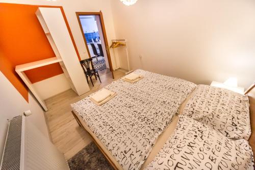 a small bedroom with a bed in a room at OH Apartments & Rooms in Ljubljana