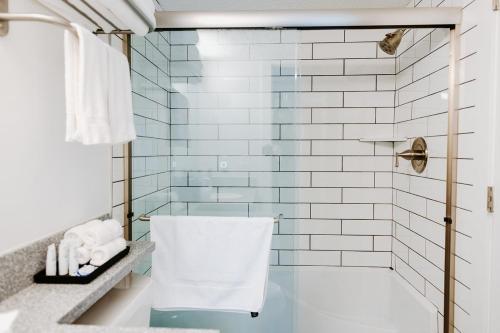 a bathroom with a shower and a white toilet at The Vinyl at Music Row - 1 Bedroom Apartment in Nashville
