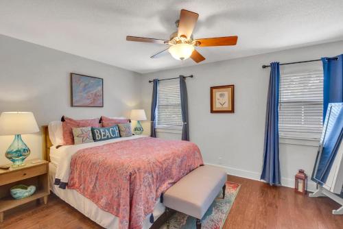 a bedroom with a bed and a ceiling fan at Courtyard Villa B-2 in Saint Simons Island