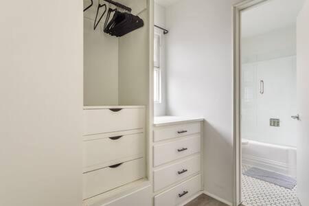 a bathroom with a sink and a mirror at AMAZING Hermosa Beach Location Free Parking in Hermosa Beach