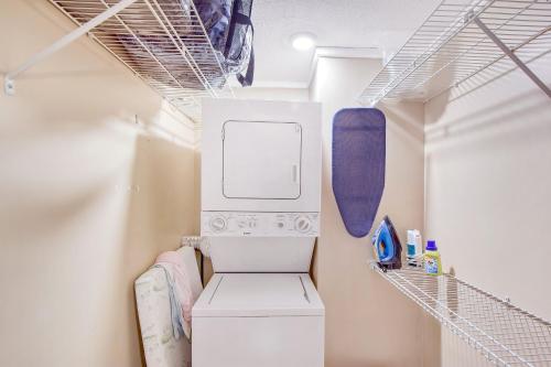 a laundry room with a washer and dryer at Mike's Place in Saint Simons Island