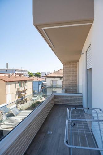 a balcony with a bed on top of a building at Residence LeoMare in Martinsicuro