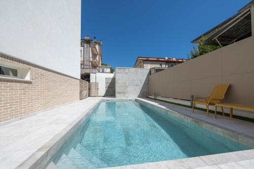 a swimming pool on the roof of a building at Residence LeoMare in Martinsicuro