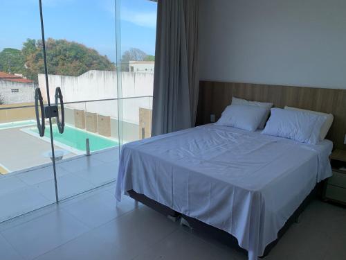 Katil atau katil-katil dalam bilik di Casa ilha Itaparica
