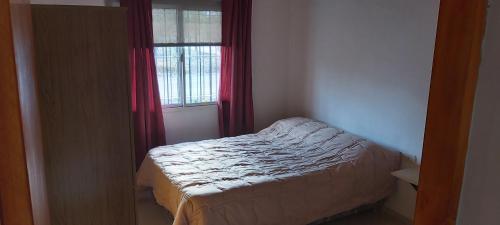 Postel nebo postele na pokoji v ubytování Cuarta División Apartment