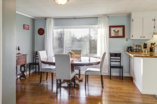 a kitchen and dining room with a table and chairs at Pet-Friendly Union Home about 19 Mi to Cincinnati! in Union