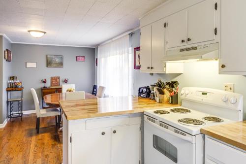 a kitchen with white cabinets and a wooden counter top at Pet-Friendly Union Home about 19 Mi to Cincinnati! in Union