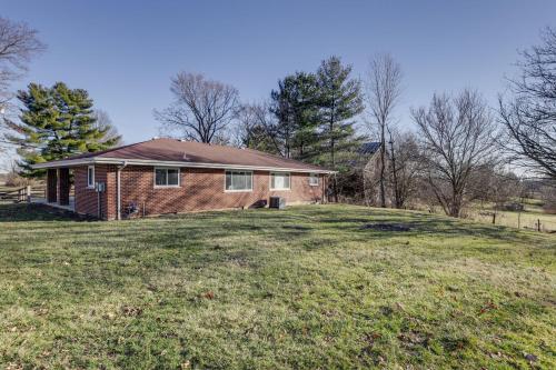 a house on top of a grassy hill at Pet-Friendly Union Home about 19 Mi to Cincinnati! in Union