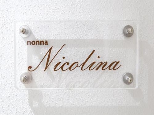 a white door with the word nederland on it at Anda e Rianda in Campi Bisenzio