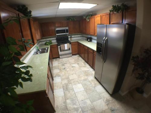 an overhead view of a kitchen with a stainless steel refrigerator at Austin Motor Inn in Austin