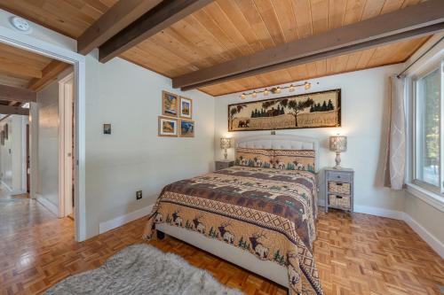 a bedroom with a bed and a wooden ceiling at Pinecone Peak in Dorrington