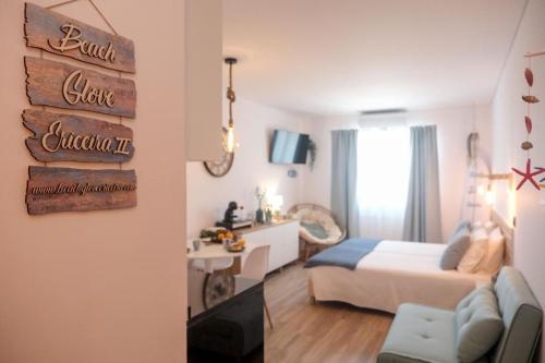 a bedroom with a bed and a desk in a room at Beach Glove Ericeira II in Ericeira