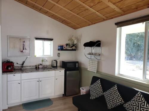 a kitchen with a sink and a counter top at Sun Tiny House D Pahrump in Pahrump