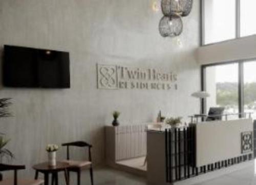 TV a/nebo společenská místnost v ubytování Twin hearts 328