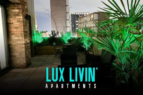 a view of a patio with green lights at Lux Livin' Apartments - Luxury 2 Bed Apartment with Sky Garden in Manchester