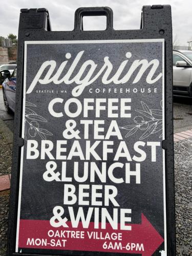 a sign for a coffee and tea breakfast and lunch dinner at Columbus Motor Inn in Seattle