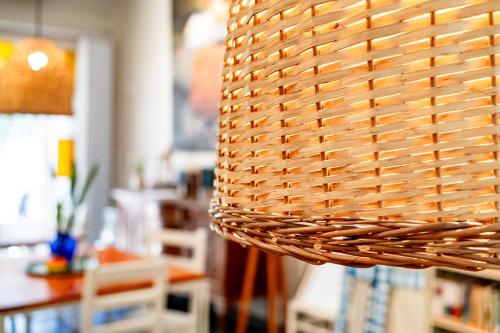 a wicker basket hanging from a wall in a room at Casa de Arte CiTá, bed and breakfasts in San Miguel de Tucumán