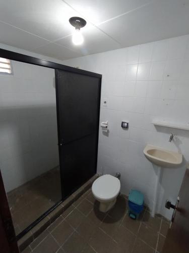 a bathroom with a toilet and a sink at Flat Tamandaré in Tamandaré