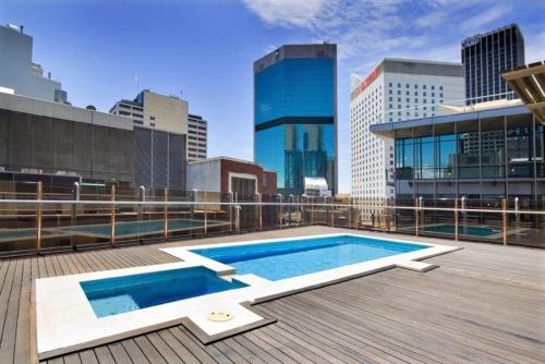 a swimming pool on the roof of a building at Cliveden - A Heritage Hideaway with Rooftop Pool in Sydney