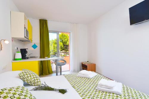 Posteľ alebo postele v izbe v ubytovaní Apartments Juka