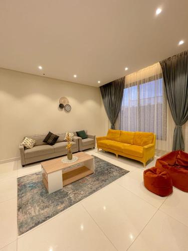 a living room with a couch and a coffee table at نزل الراشد الفاخرة luxury in Abha