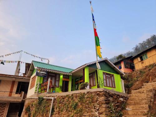 a house with a flag on top of it at Neoravalley Homestay, Icche Gaon in Pedong