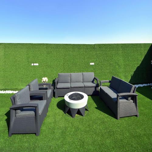 a patio with chairs and a couch and a table at الدانة للشقق الفندقية in Kuwait