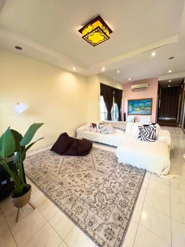 a bedroom with two beds and a rug at RUMAH SANTAI in Sungai Petani