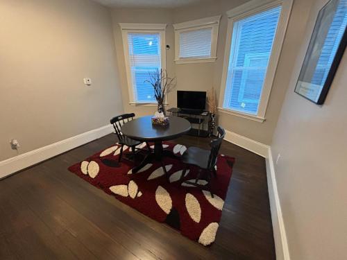 a dining room with a table and chairs at HomeStay B&B in Boston - 3 locations in Dorchester in Boston