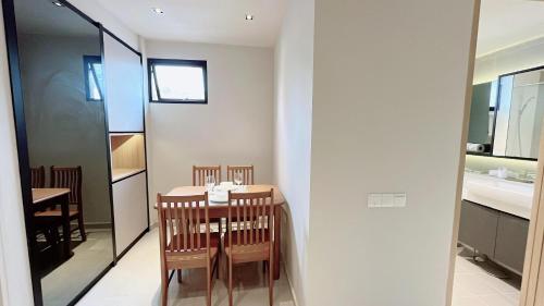 a small dining room with a table and chairs at Moulmein Studios by K&C Serviced Apartment in Singapore