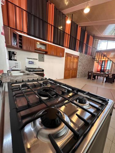 a kitchen with a stove top oven in a room at Blasina el valle in Valle de Anton