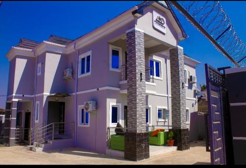 a rendering of a purple house at D'EXQUISITE APARTMENTS in Ibadan