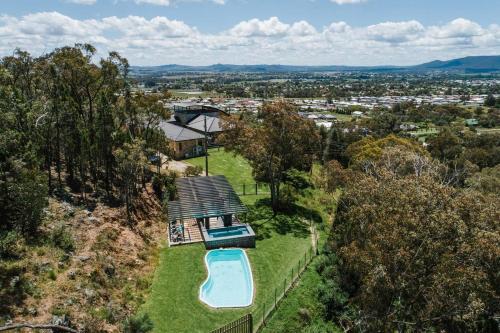 an aerial view of a house with a swimming pool at 'Tyalla Lodge' Unique Luxe Design in the Mountains in Mudgee