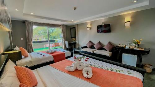 Postel nebo postele na pokoji v ubytování Dusit Hotel Siem Reap