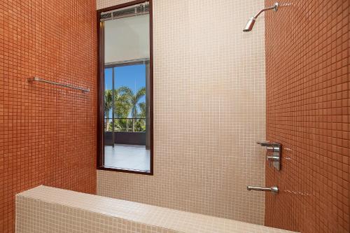 a bathroom with a mirror and a shower at Pool Access Villa Argent 8, 3-Bedroom near Mission Hills Golf in Thalang