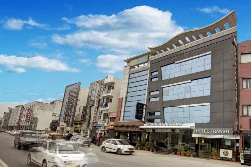 a city street with cars parked in front of a building at Hotel International Inn by Star group - Near Delhi Airport in New Delhi