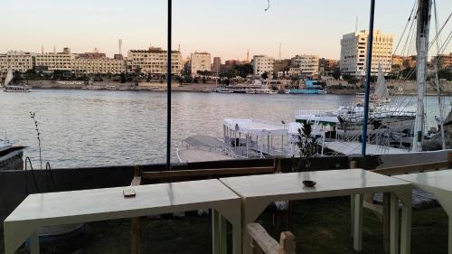 a view of a harbor with a boat in the water at Onaty Narty Guest house in Aswan